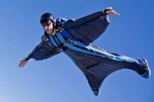 Tero Potila flying a wingsuit over Lake Elsinore, CA.