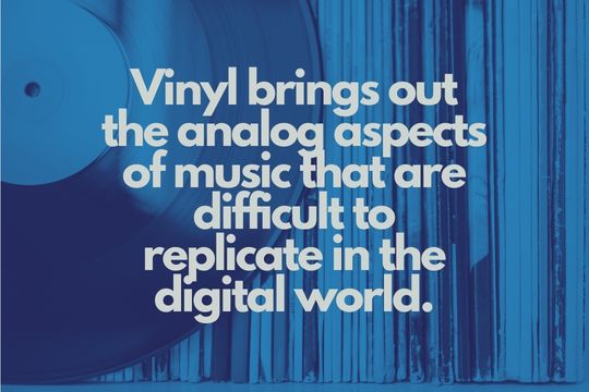 Best Vintage Record Player for Vinyl: A vinyl out of its case in front of a shelf full of vinyl records.
