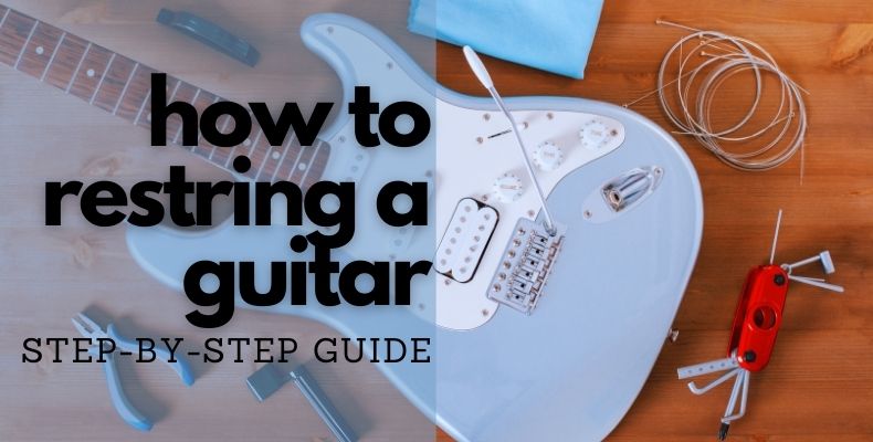 How to Restring a Guitar: an electric guitar, replacement strings and all the tools needed for restringning the guitar laid out next to it.