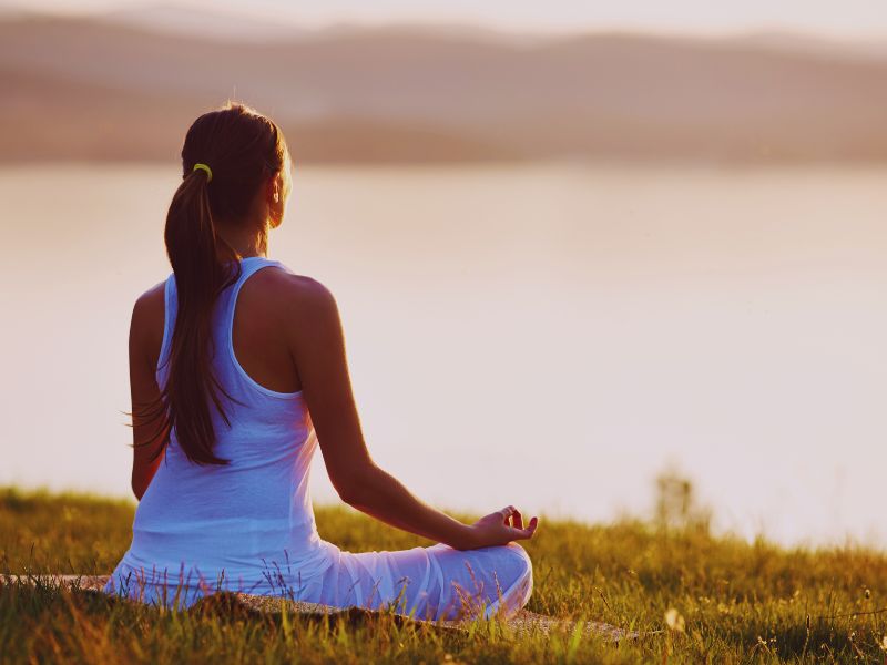 Yoga Meditation Music: A yogi sitting calmly enjoying one of today's most popular stress management strategies.
