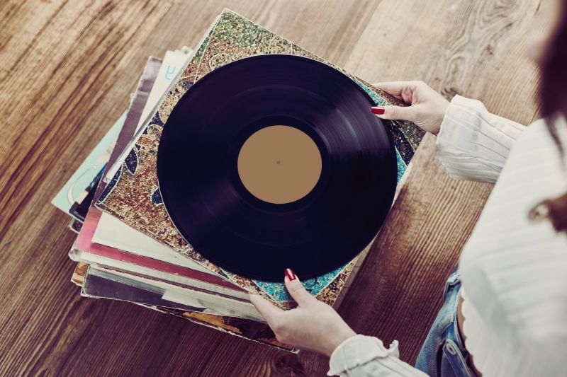 a person holding a record