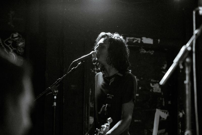 a man singing into a microphone
