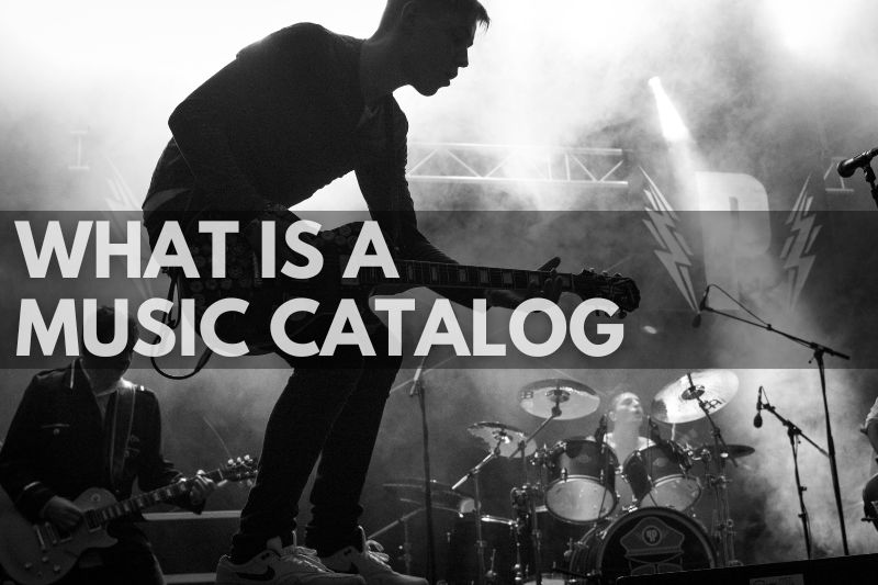 What Is A Music Catalog & Why Are Artists Selling: a band playing instruments in a live concert on stage