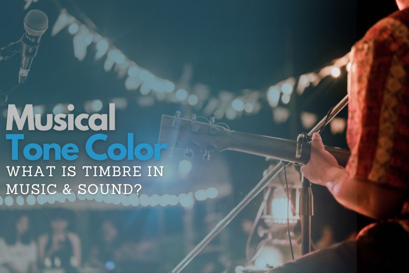Musical Tone Color: An artist playing an acoustic guitar on the stage in front of lights and a small audience.