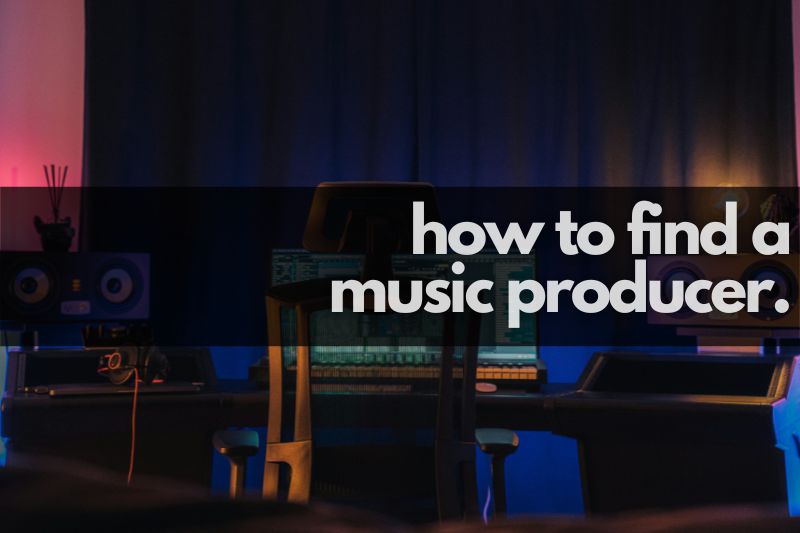 How to find a music producer - a typical production studio setup with a computer screen, desk, keyboard, speakers and a chair