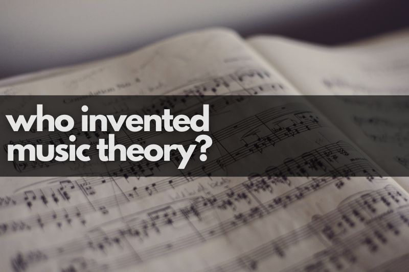 Who invented music theory? A close up of a music book with musical notation and some handwritten notes on it.