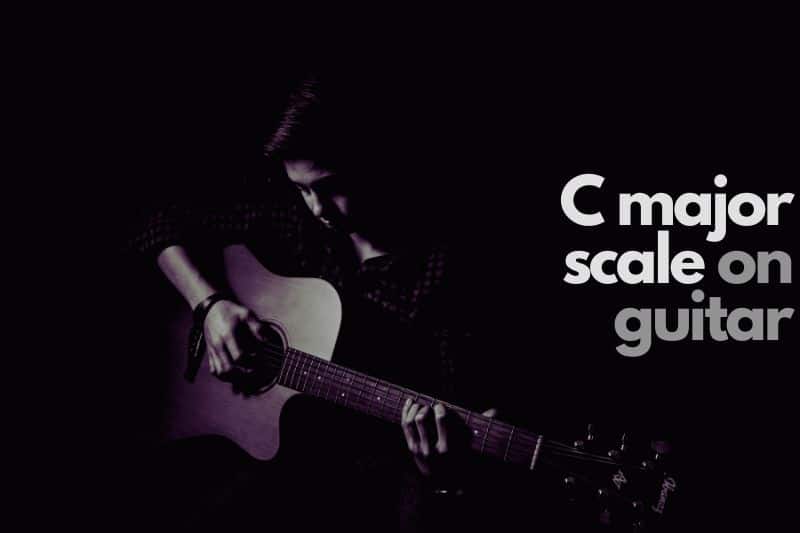 A guitarist playing the C major scale on guitar