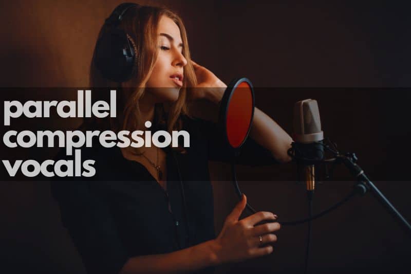 Parallel compression vocals: A singer performing in the recording studio in front of a microphone and pop shield.