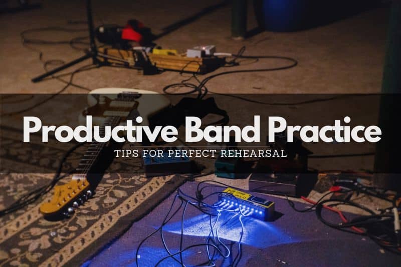 Band Practice: A guitar, cables and guitar pedals on the floor of a band rehearsal space.
