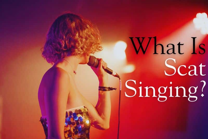 What is scat singing? A jazz vocalist holding a microphone and singing with bright stage lights behind her.