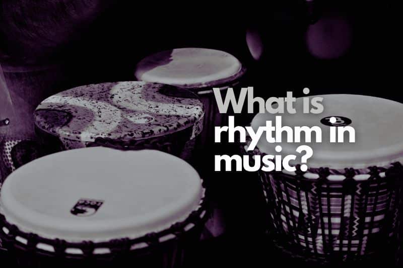 What is rhythm in music: 3 different sizes of djembe drums next to a stool, ready for a percussionist to come and start playing.