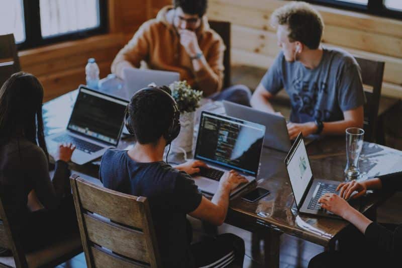 A development team working on their laptops